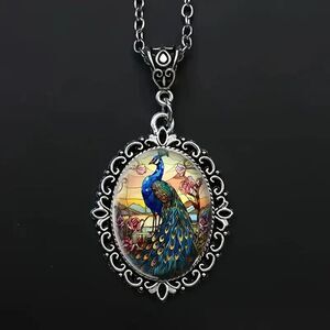 A Charming Oval Pendant Necklace Featuring a Peacock Design.